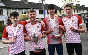 Ennis Track AC, Clare, athletes celebrate with their gold medals, senior men's relay trophy and the Patrick Boland trophy after competing in the men's senior relay during the 123.ie National Road Relay Championships in Raheny, Dublin. Photo by Tyler Miller/Sportsfile