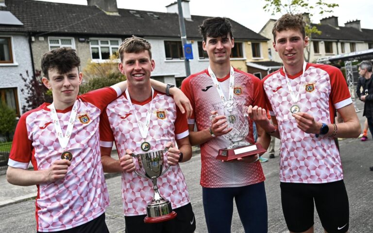 Ennis Track AC, Clare, athletes celebrate with their gold medals, senior men's relay trophy and the Patrick Boland trophy after competing in the men's senior relay during the 123.ie National Road Relay Championships in Raheny, Dublin. Photo by Tyler Miller/Sportsfile