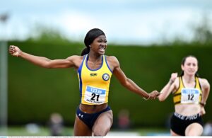 5 July 2025; Precious Akpe-Moses of Blackrock AC, Louth, left, celebrates winning the U20 women 100m during the 123.ie National U20 & U23 Championships at Tullamore Harriers Athletics Club in Tullamore, Offaly. Photo by Sam Barnes/Sportsfile