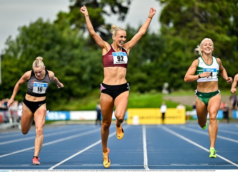 2 August 2025; Sharlene Mawdsley of Newport AC, Tipperary, celebrates winning the senior women's 200m final, ahead of Sarah Lavin of Emerald AC, Limerick, right, who finished second, and Lauren Roy of Fast Twitch AC, left, who finished third, during day one of the 153rd 123.ie National Track & Field Senior Championships at Morton Stadium in Dublin. Photo by Sam Barnes/Sportsfile