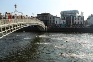2024 Dublin City Liffey Swim 7/9/2024 A view of the Women’s race as they pass the Ha’penny Bridge Mandatory Credit ©INPHO/Ben Brady