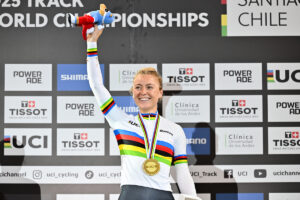 Lara Gillespie, World Champion, Elimination Race, 2025. Picture by Simon Wilkinson/SWpix.com - 23/10/2025 - Cycling - 2025 Tissot UCI Track World Championships - Velódromo Peñalolén, Santiago, Chile - Women’s Elimination Race Podium - Lara Gillespie (Ireland) receiving the Gold Medal to become World Champion.