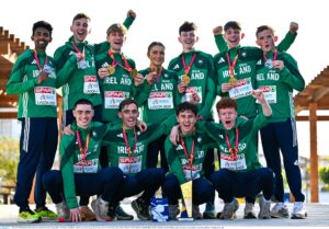 14 December 2025; Ireland medalists, back row, from left, Efrem Gidey, Cormac Dalton, Nick Griggs, Emma Hickey, Niall Murphy, Callum Morgan, Jack O'Leary; front row, from left, Darragh McElhinney, Brian Fay, Jonas Stafford and Lughaidh Mallon with their medals after the 2025 SPAR European Cross Country Championships in Lagoa, Portugal. Photo by Sam Barnes/Sportsfile