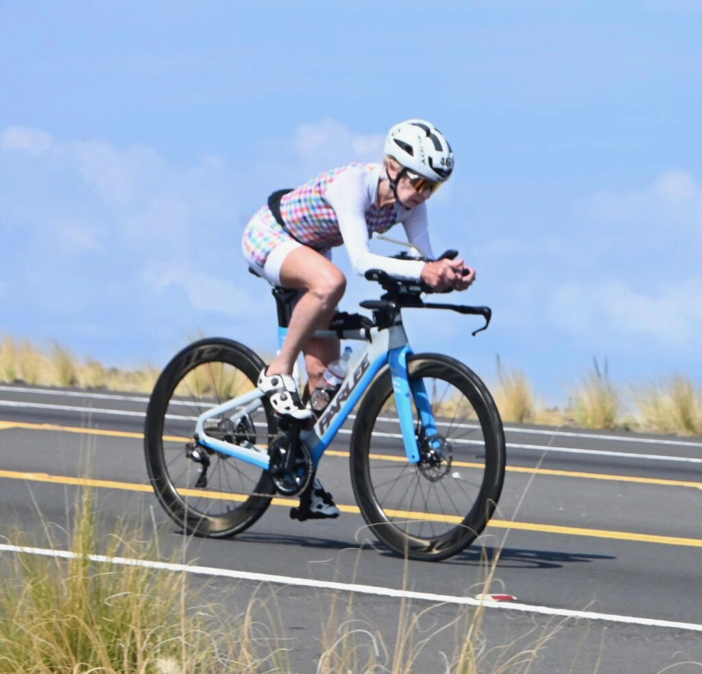 Natalie Grabow, rides through the lava fields at the IRONMAN World Championship in Kona Pic Credit: Finisherpix