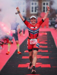Jen Done Crosses the Finish Line in Copenhagen after completing her second IRONMAN in two Days.
